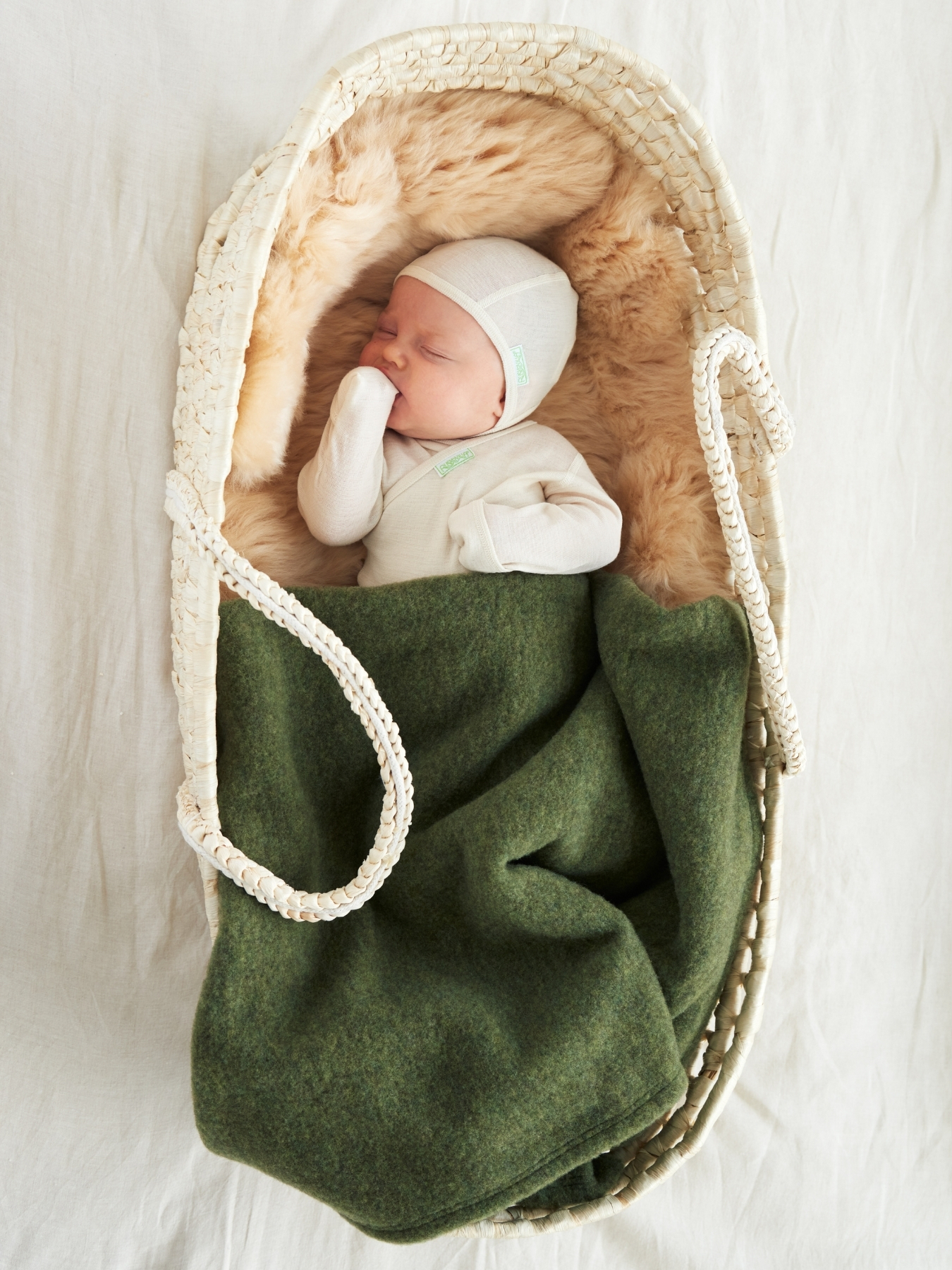 Ruskovilla's baby comforter in organic merino wool fleece in green