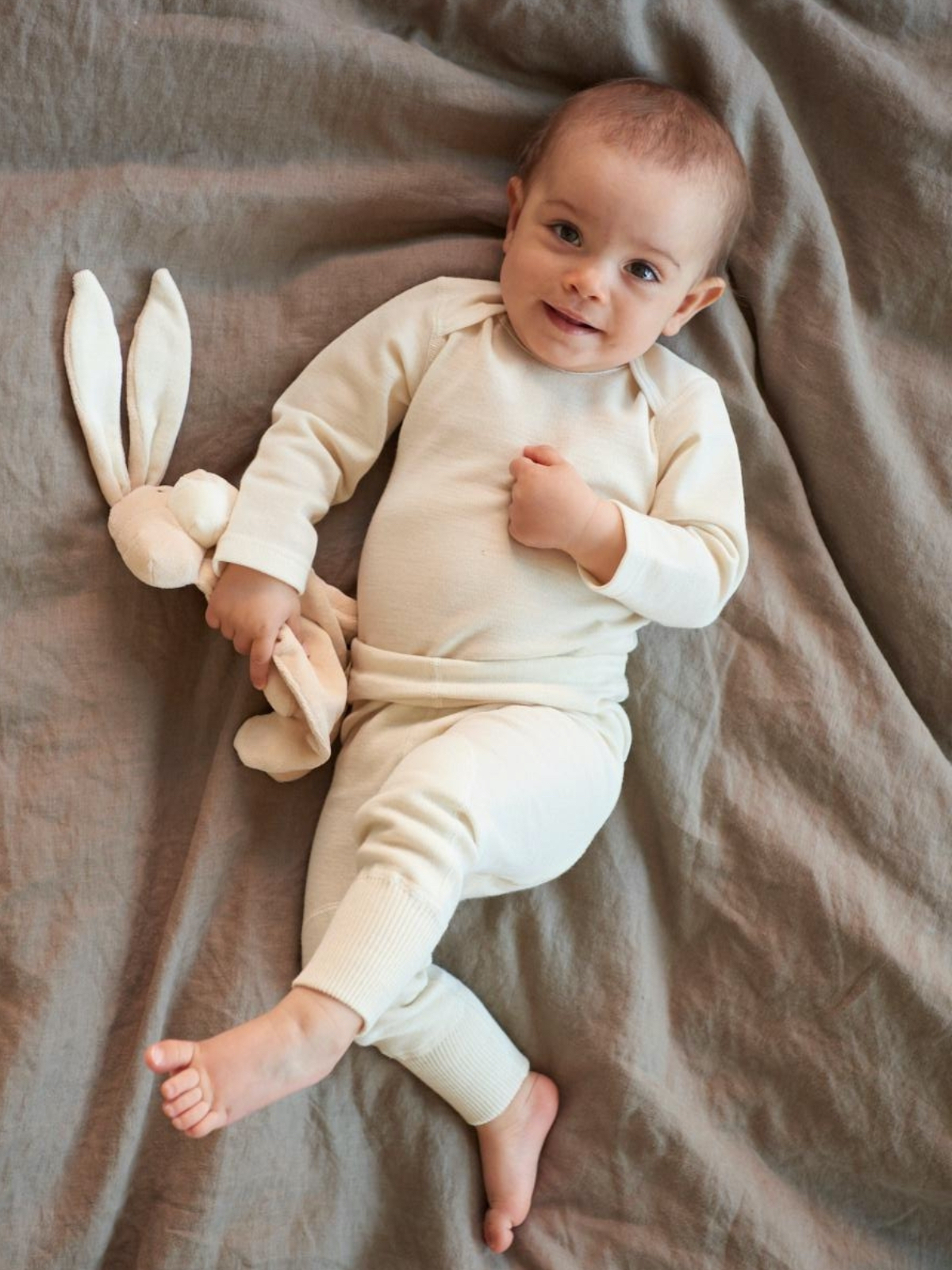 Ruskovillan valkoinen vauvan body luomumerinovillaa
