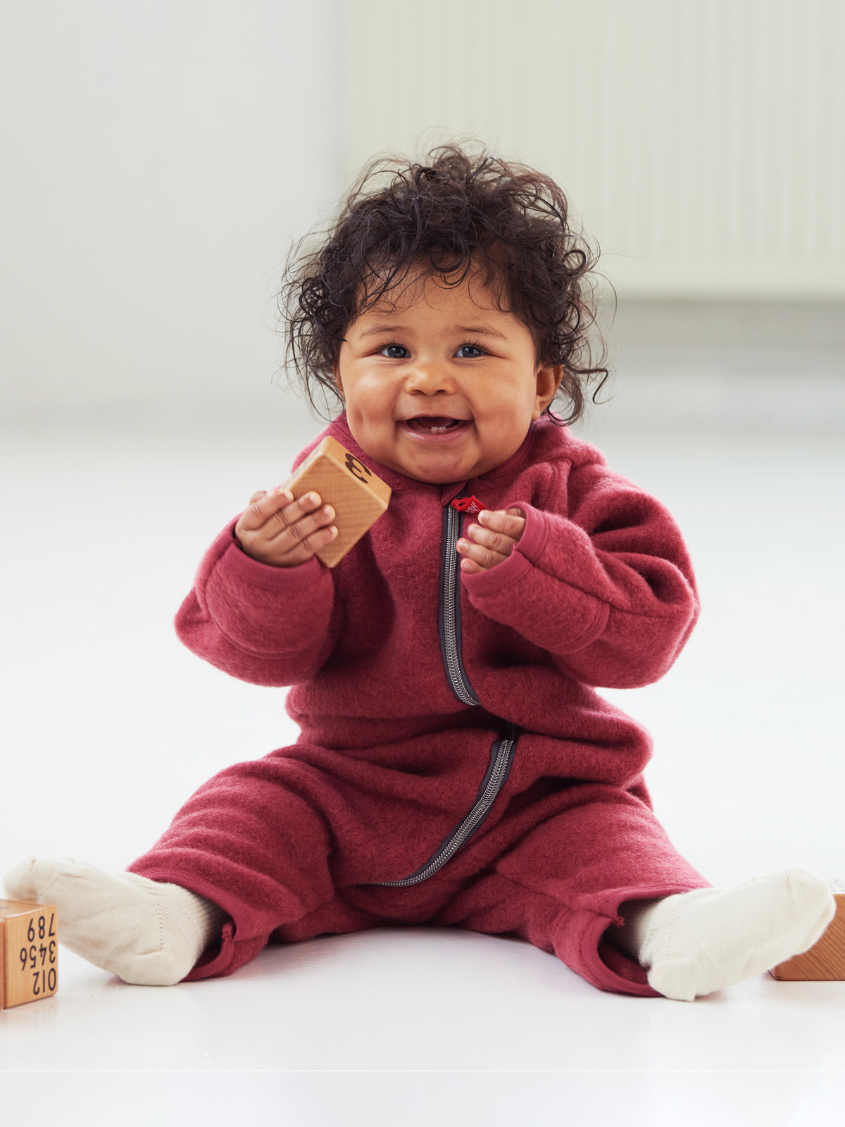 Ruskovilla's baby's organic merino wool fleece overall in red
